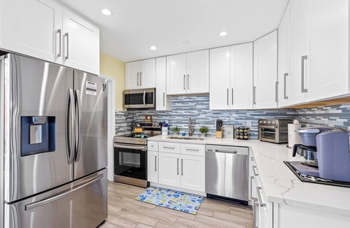 Golfview Harbor House | Waterfront Heated Pool Home w/Putting Green, Pergola & Air Hockey