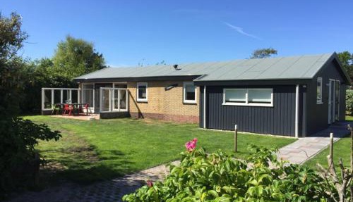 bungalow situated directly at a large sand dunes in Ballum