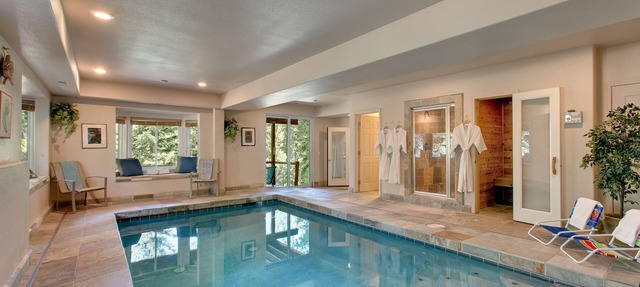 Indoor heated pool, spacious deck, seven rooms with beds, hot tub, and more! in South Lake Tahoe