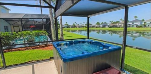 Lake Berkley Villa | Sunny South Facing Pool with Hot Tub and Lake View Near Disney